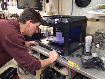 The Boston Home’s Don Fredette works on a project using a MakerBot printer. Photo courtesy TBH